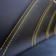 A photo of the black leather and yellow stitching inside the Maserati Ghibli.